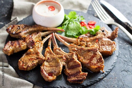 Grilled lamb ribs with spices and yoghurt sauce photo