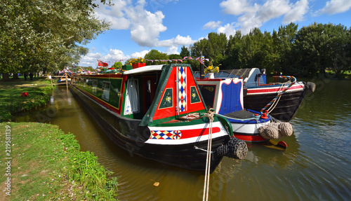 Foto Decorated Narrow Boat moored on the river