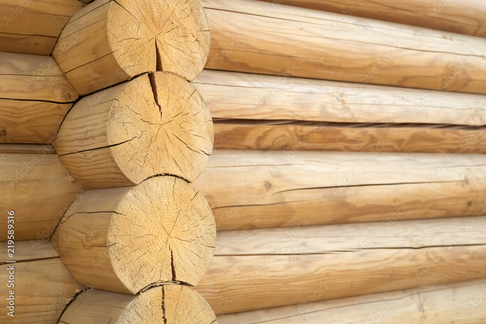 Brown rustic wooden texture background. Facade of a log house, copy space Brown rustic wooden texture background. Facade of a log house, copy space