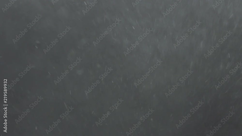 Slow motion explosion effect of backlit dust particles on a black background Slow motion explosion effect of backlit dust particles on a black background