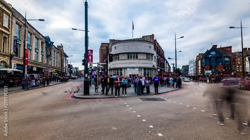 Timelapse view of a busy crossroad at a traffic lightat Camden Town in London photo