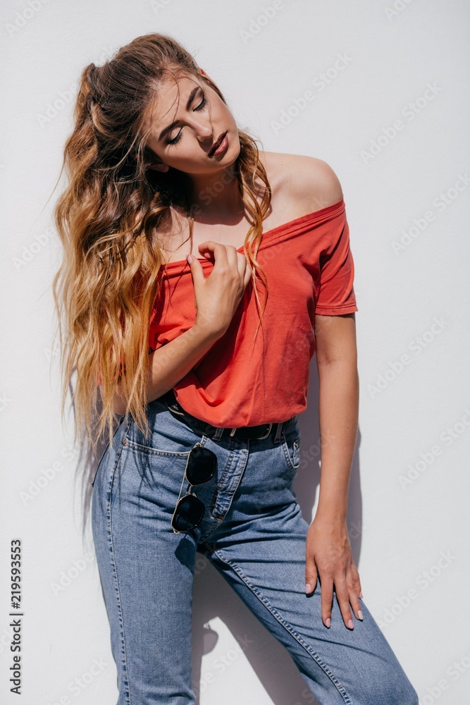 Portrait of beautiful woman with makeup in fashion clothes and glasses