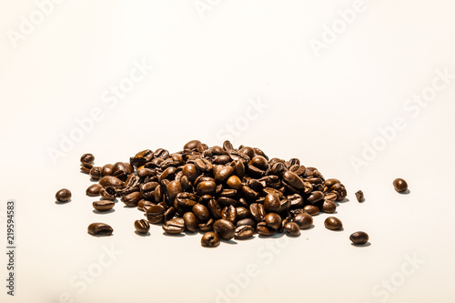 Roasted coffee beans image on white background, with space for text. Check my profile for similar images.