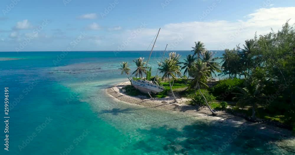 Abandoned sailboat on a beach in aerial view Abandoned sailboat on a beach in aerial view