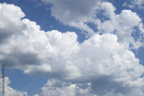 white clouds stretch all over the blue sky