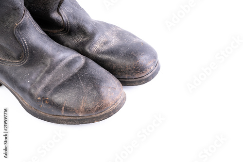 Kirza boots on white background, retro boots, made of artificial leather, used in Soviet Union for soldiers in the army and for work