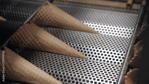 The conveyor automatic lines for the production of ice cream cones. Wafer cups and cones. Large industrial production. A major supplier of ice cream to the retail network