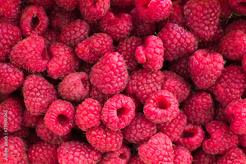 Ripe juicy fresh raspberries. Natural food background.