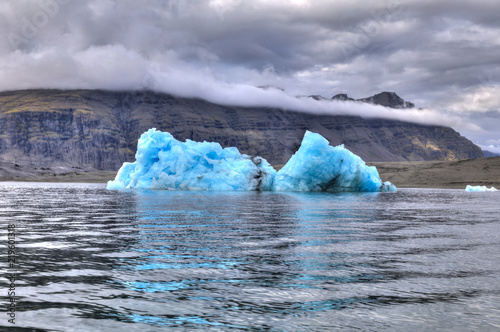 Iceberg, skies, mountains, lagood and lakes photo