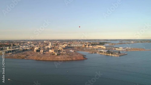 Harbor cityscape, Aerial view towards jatkasaari island, on a sunny summer evening, in Helsinki, Uusimaa, Finland photo