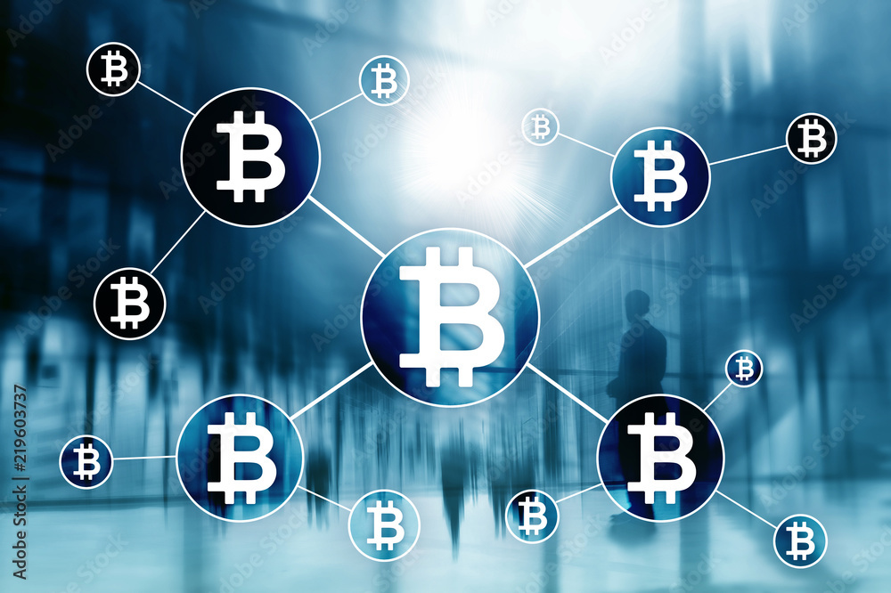Bitcoin cryptocurrency and blockchain technology concept on blurred skyscrapers background. Bitcoin cryptocurrency and blockchain technology concept on blurred skyscrapers background.