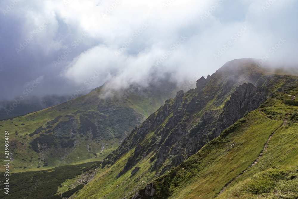 mountains and rocks in clouds and fog mountains and rocks in clouds and fog