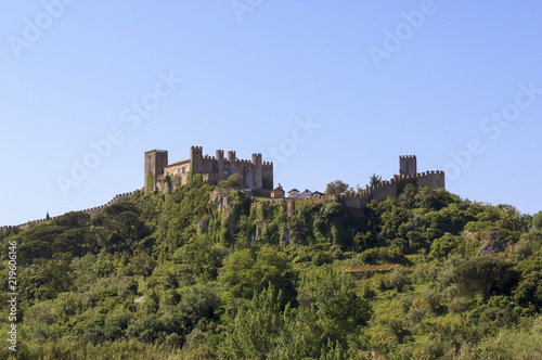 Beautiful view of the fortress. The ancient castle and wall of Obidos, Portugal. Castelo de Obidos. One of the most popular tourist destinations.