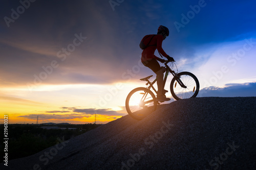 Silhouette of cyclist in motion © Aunging