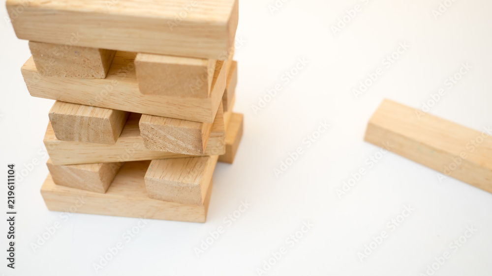 Falling tower close up on white background Falling tower close up on white background