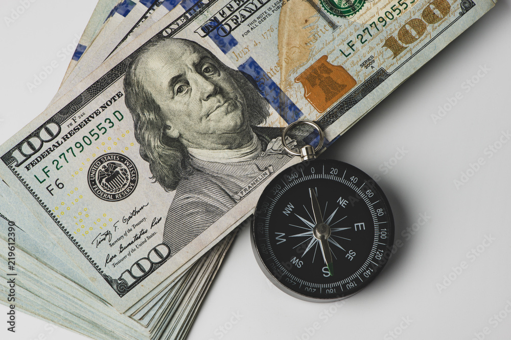 Compass and money. US banknote. Financial concept. Compass and money. US banknote. Financial concept.
