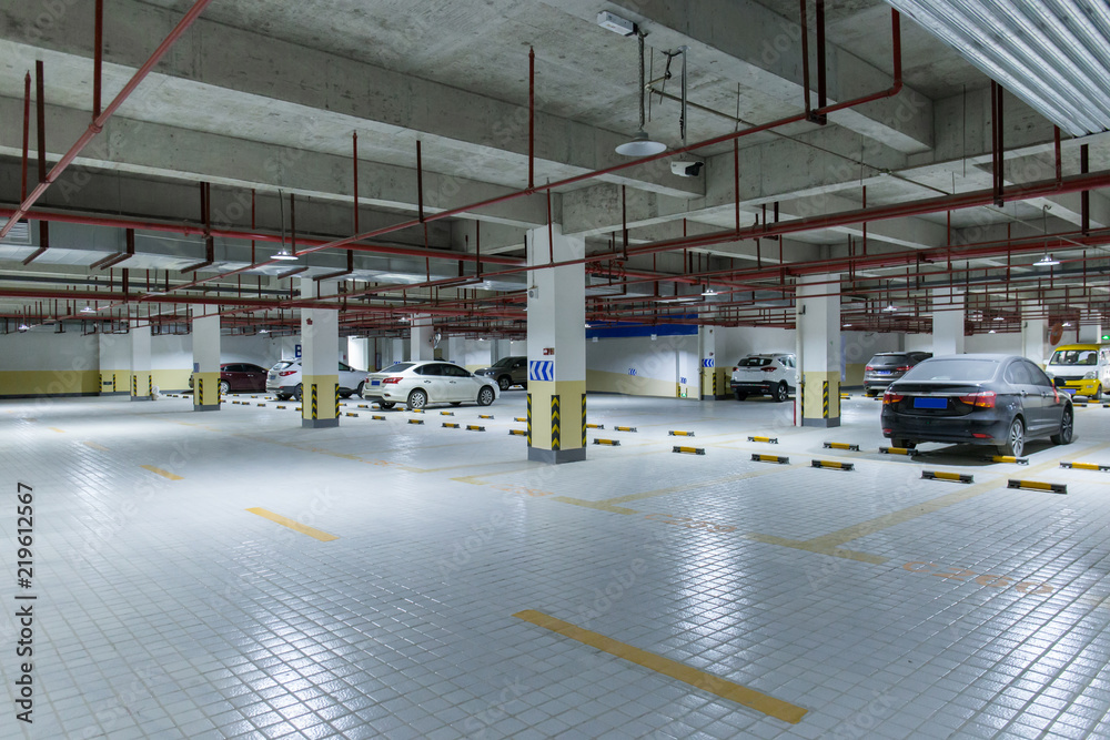 Fototapeta premium Underground parking garage and car parked inside