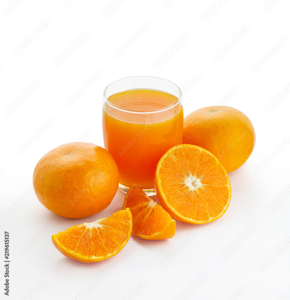 A glass of orange juice and an oranges isolated on white background A glass of orange juice and an oranges isolated on white background