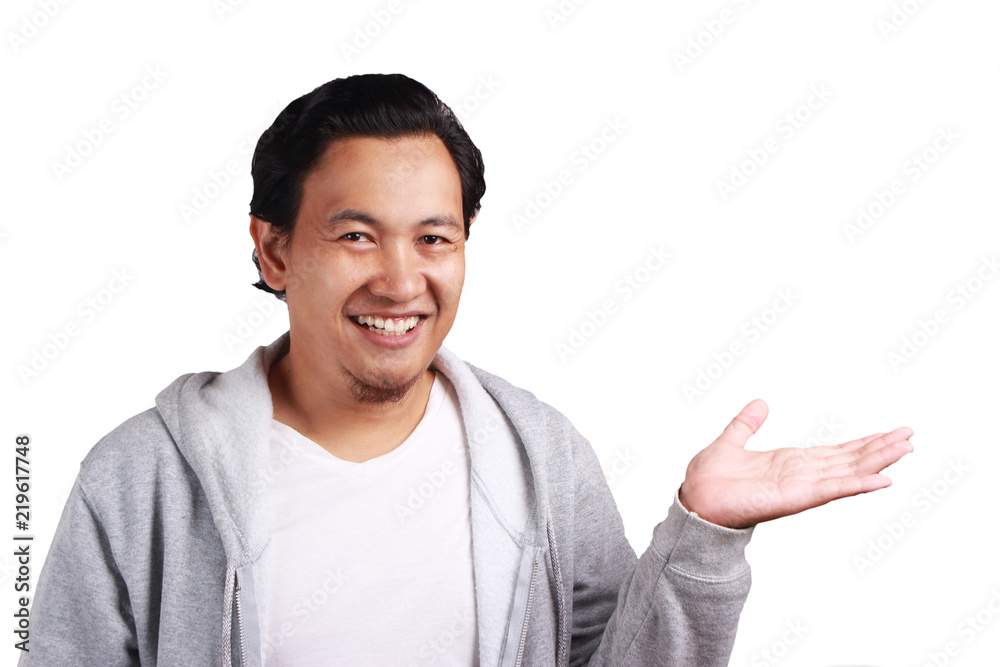 Young Man Showing Something in His Empty Hand Young Man Showing Something in His Empty Hand
