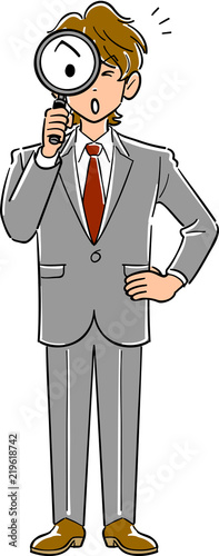 虫眼鏡を持つビジネスマン
