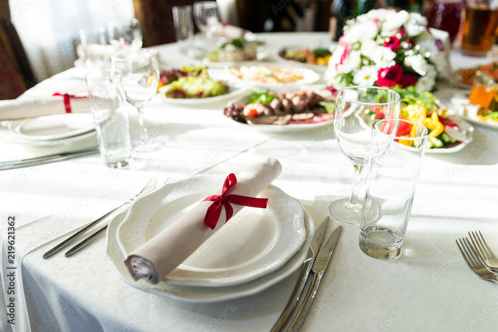 Wedding decorated table. Luxury light decor on table in restaurant	