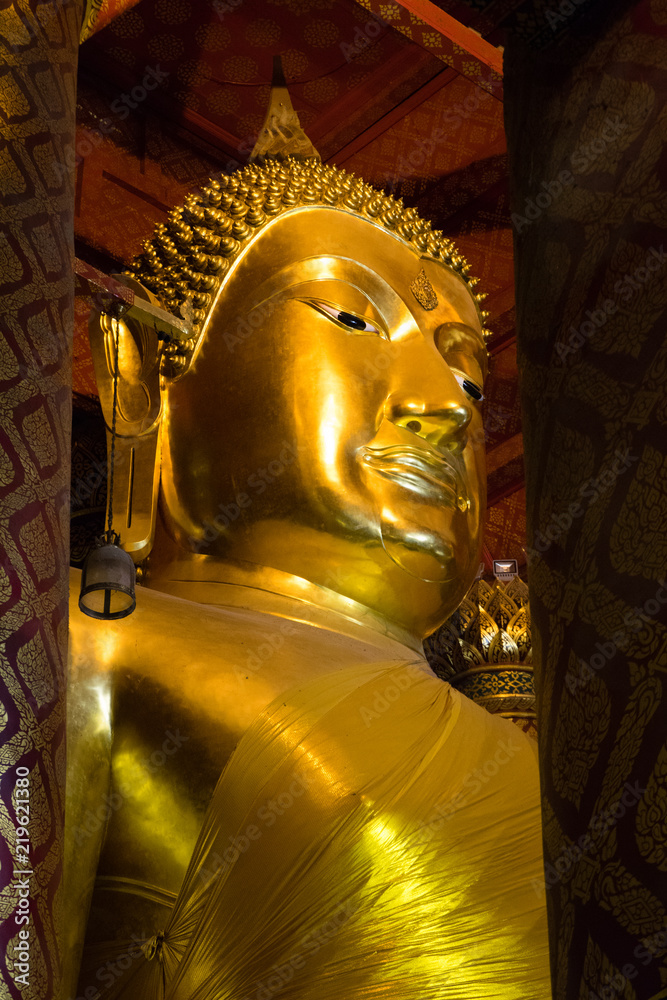 Big golden buddha statue inside chapel