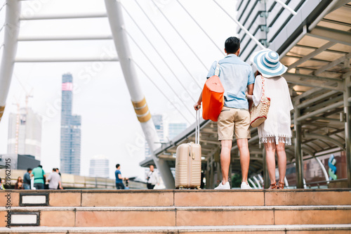 Tourists couples looking for a place in the city where tourism destinations during his vacation. © Sumala