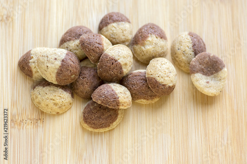 Cinnamon sandbakelse christmas cookies, two color, cocoa dark brown and vanilla light golden brown, delicious czech cookies photo