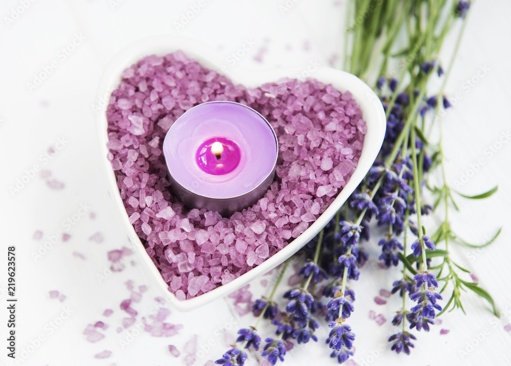 Heart-shaped bowl with sea salt, soap and fresh lavender flowers Heart-shaped bowl with sea salt, soap and fresh lavender flowers