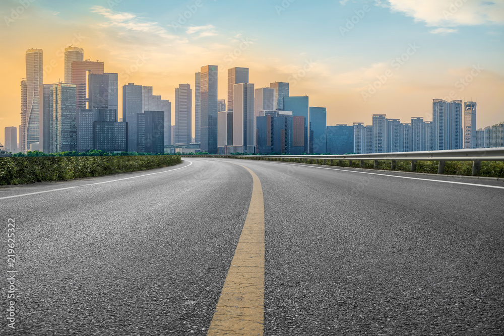 Urban road asphalt pavement and skyline of Hangzhou architectural landscape