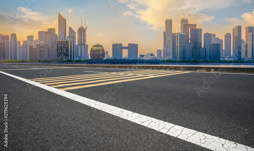 Urban road asphalt pavement and skyline of Hangzhou architectural landscape