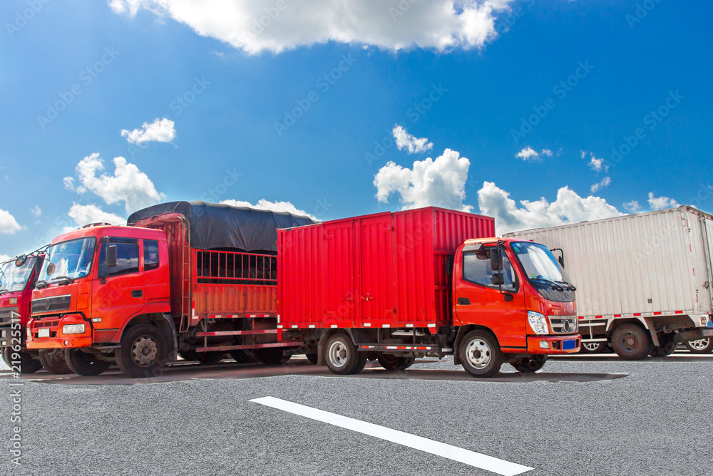 Red trucks docked in the square Red trucks docked in the square