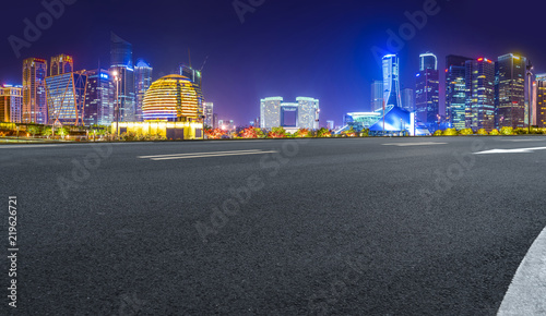 Urban road asphalt pavement and skyline of Hangzhou architectural landscape