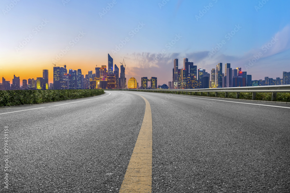 Fototapeta premium Urban road asphalt pavement and skyline of Hangzhou architectural landscape