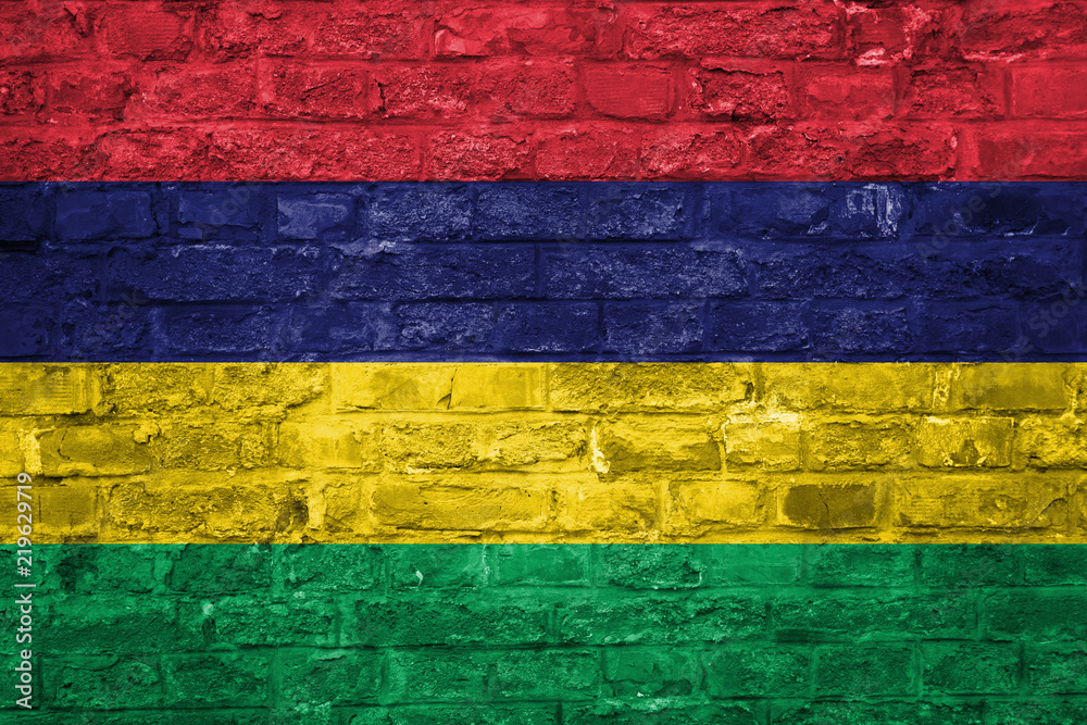 Flag of Mauritius over an old brick wall background, surface