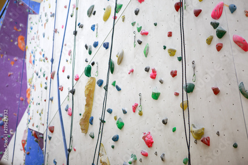 Photo of climbing wall with safety ropes