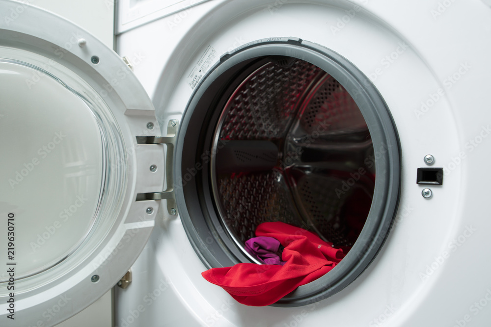 Image of open washing machine with red cloth Image of open washing machine with red cloth