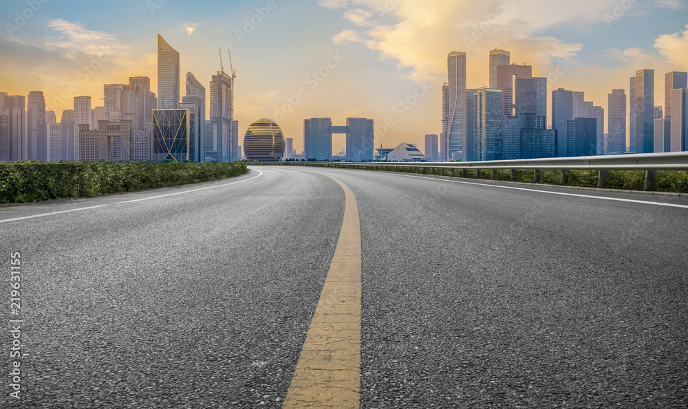 Urban road asphalt pavement and skyline of Hangzhou architectural landscape