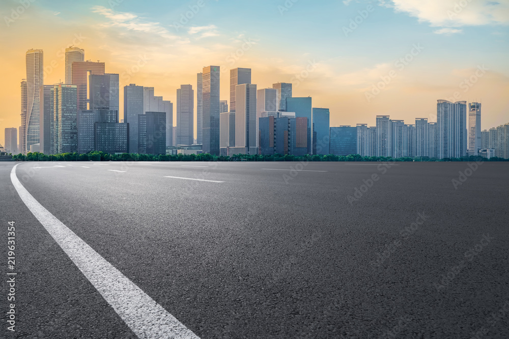 Urban road asphalt pavement and skyline of Hangzhou architectural landscape