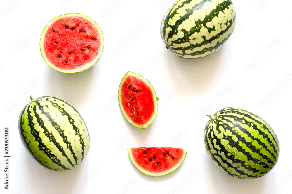 Bright summer white background with watermelons. Flat lay Bright summer white background with watermelons. Flat lay