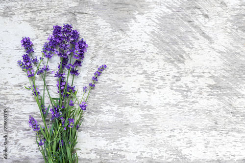 Lavender flowers bouquet on rustic wooden background. top view with copy space