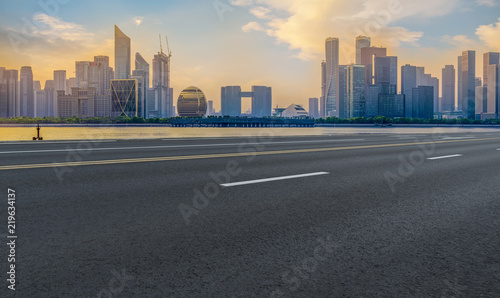 Urban road asphalt pavement and skyline of Hangzhou architectural landscape