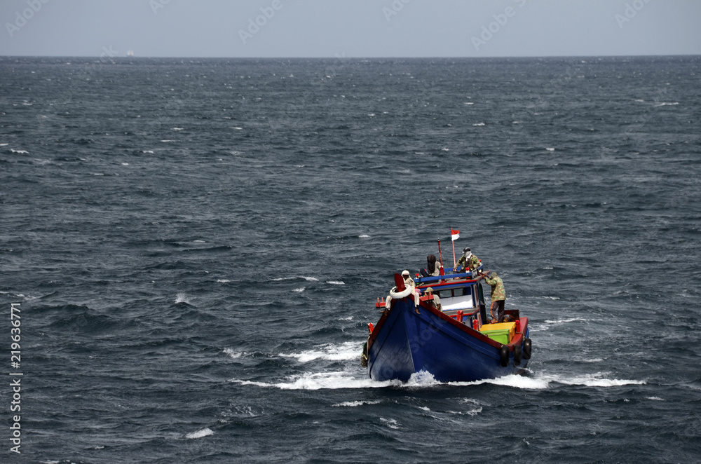 Naklejka premium Fishing boat and fishermen, sumatra, indonesia