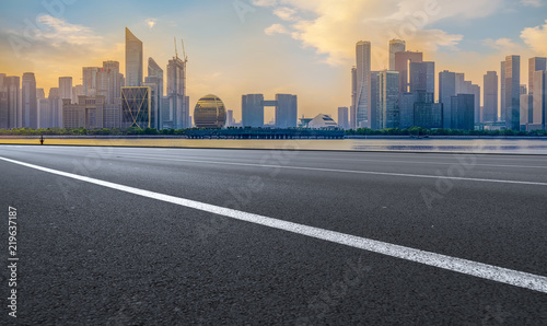 Urban road asphalt pavement and skyline of Hangzhou architectural landscape