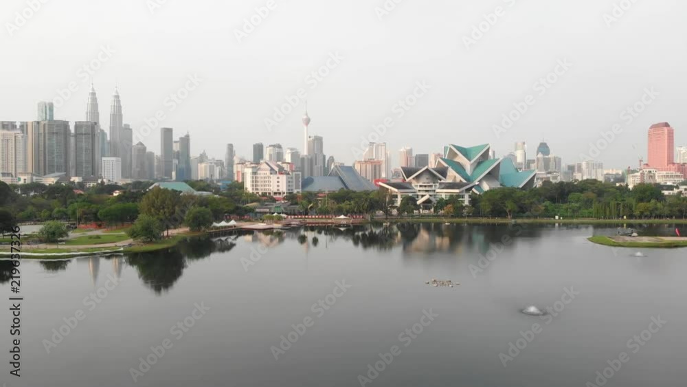 left aerial sweep of kuala lumpur skyline from park lake left aerial sweep of kuala lumpur skyline from park lake