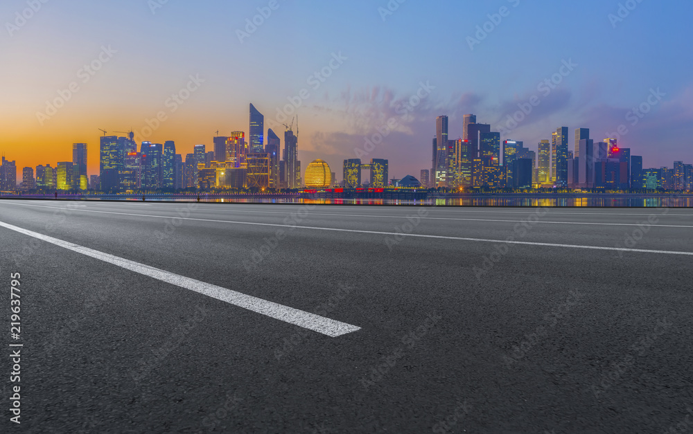 Fototapeta premium Urban road asphalt pavement and skyline of Hangzhou architectural landscape