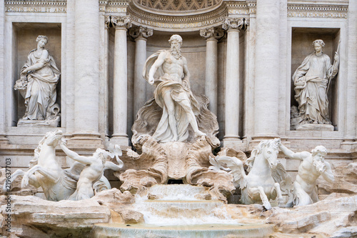 The Trevi fountain with Oceanus, god of the sea, in the center in Rome, Italy photo