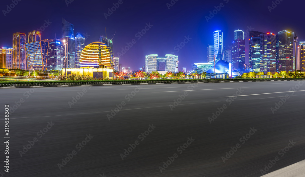 Urban road asphalt pavement and skyline of Hangzhou architectural landscape