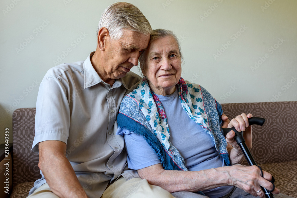 Family, elderly couple. The old man hugs his wife. Concept: Happy old age, care, love. Family, elderly couple. The old man hugs his wife. Concept: Happy old age, care, love.