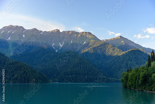 Beautiful mountain Lake Ritsa. Lake Ritsa in the Caucasus Mountains, in the north-western part of Abkhazia, Georgia, surrounded by mixed mountain forests and subalpine meadows. © Maks_Ershov